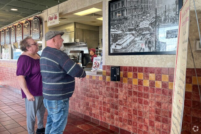 Lake County residents admire artowrk inside Ray Lake Kettle Grove Nature's beloved Fratellos.