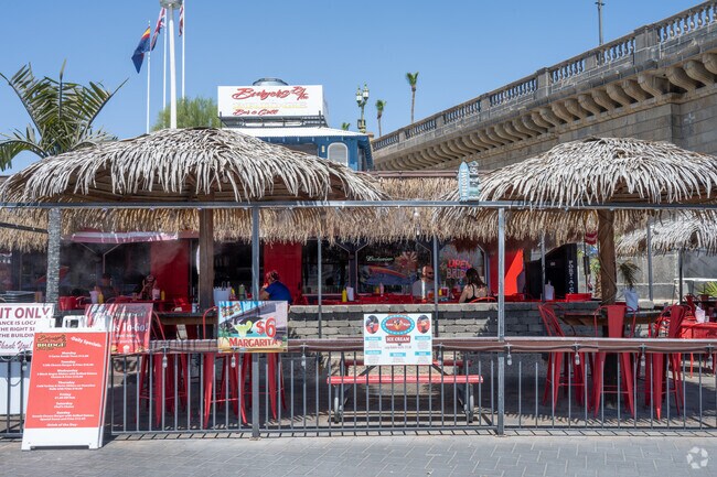 Enjoy a drink by the water at a Tiki themed bar.