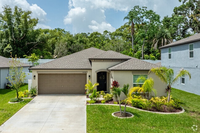 Ranch-style homes in Zephyrhills West include tidy landscaping and two-car garages.