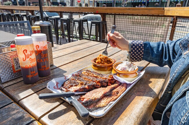 Enjoy delicious barbecue dishes at Swing Inn Café & BBQ near Rancho Highlands.