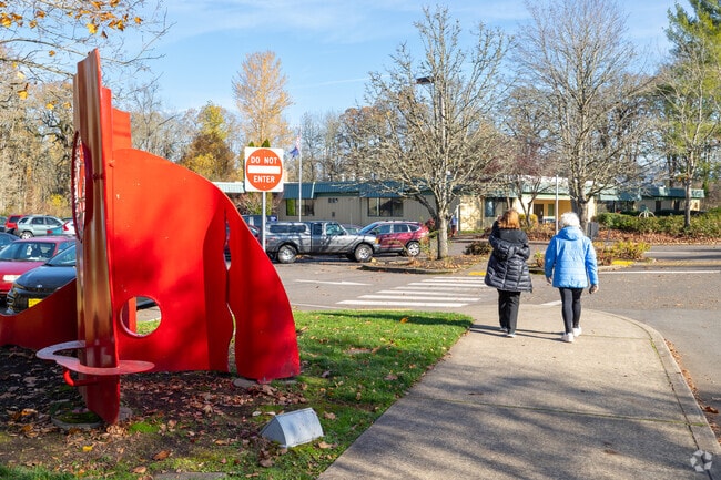 Women walk through the North Clackamas Community Park on the west side of Oatfield.