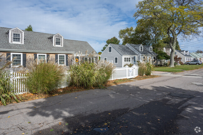 A row of Cape Cod homes line this Strawberry Hill street.
