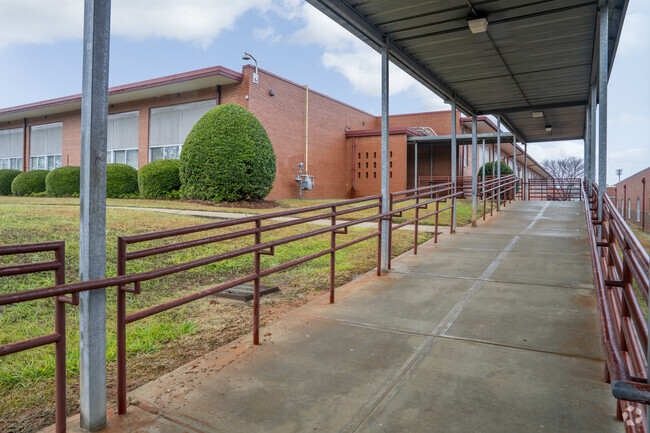 Walkways connect West Mecklenburg High School campus buildings.