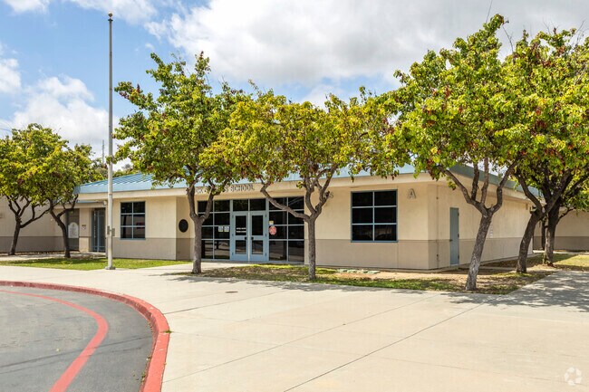 Tres in front of the school building at the Rock Springs Elementary School in Escondido.