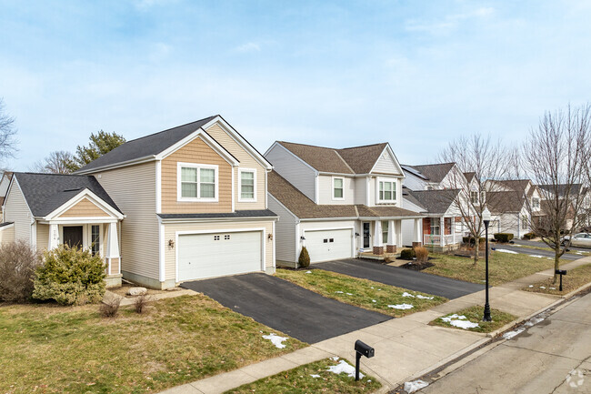 Surrounded by young maple and oak trees, the homes of Wynstone follow the gently curving streets in long rows of Colonial Revivals and Contemporary Craftsmen.