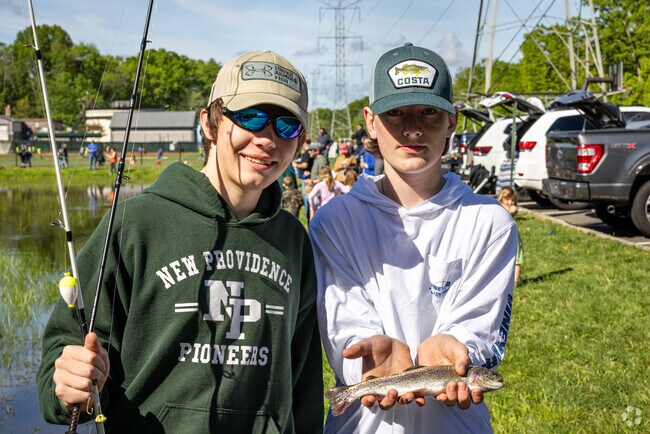 The winners of the 2024 New Providence Annual Fishing Derby show off their catch.