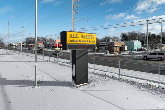 All Saints Catholic Elementary School has a sign near the main road.