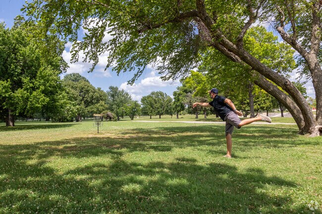 Disc golfers enjoy the well known Dovillio disc golf course in Crescent Heights.