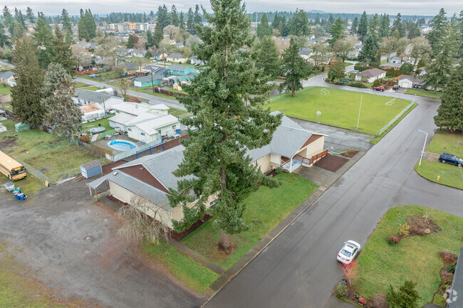 A towering fir tree rises in front of Sky View Baptist Academy in Vancouver, WA.