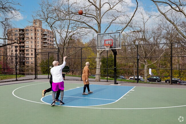 At Henry Hudson Park in Spuyten Duyvil friends play pickup basketball.