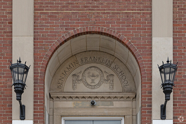 Benjamin Franklin's name gleams proudly as a symbol of education and community.