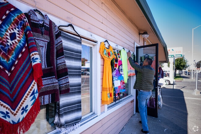 A shop keeper prepares for a busy day in Vallejo Heights.