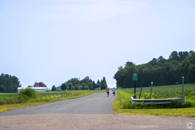 Residents enjoy a quiet walk through a Bloomer neighborhood.