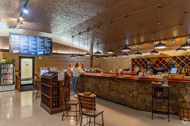 You enjoy tasting locally made wine at Stonehaus Winery.