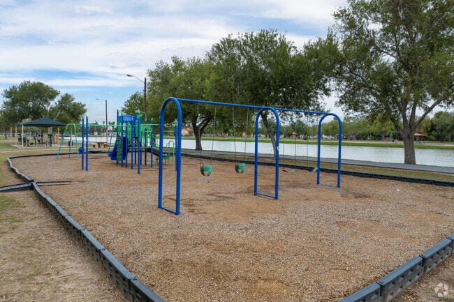 Kids can enjoy a waterfront playground at Heavin Park in San Benito, Texas.