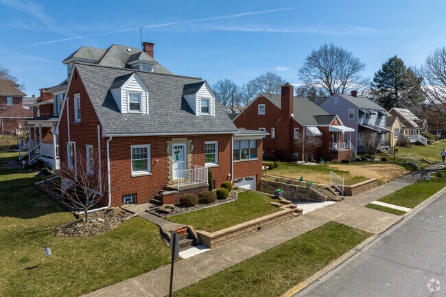 Southwest Greensburg neighborhoods featuring below-ground garages and Cape Cod style homes.