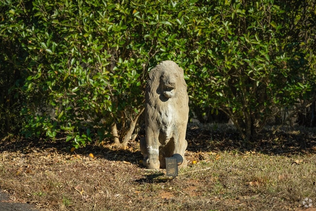 Some homes in Tigerville have small animal statues in their front yards.