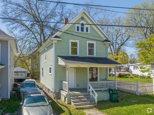 Classic Folk Victorian homes with simple trim and signature sloping rooflines in the Fabulous Acres neighborhood