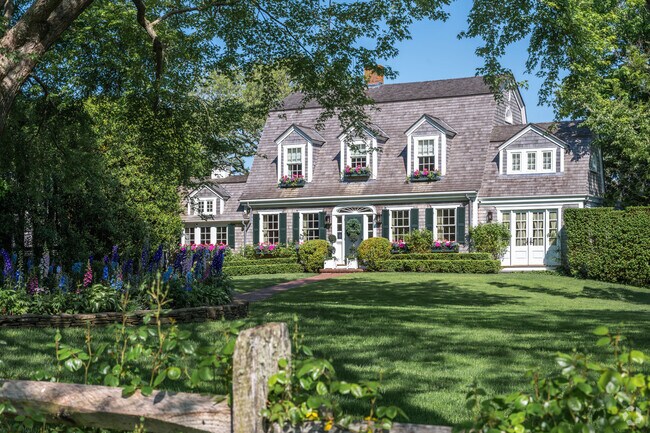 A large Cape Cod home with a gambrel roof in Edgartown.
