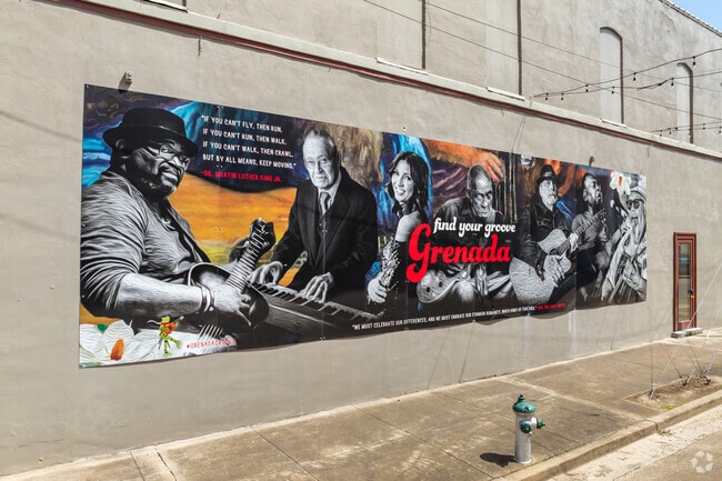 The vibrant colors and uplifting message make this mural in downtown Grenada a must-see for art lovers and locals alike.