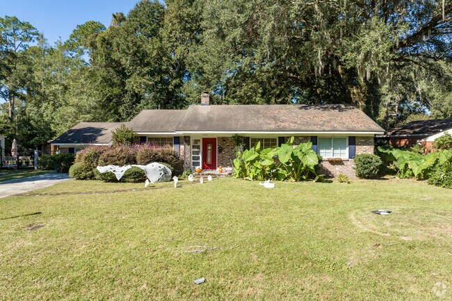 Brick Ranch homes in the neighborhood reside on lots with well manicured lawns.