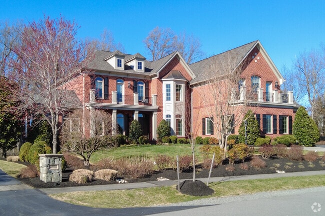 Colonial homes with well manicured landscaping line many of the streets in Wolf Trap.
