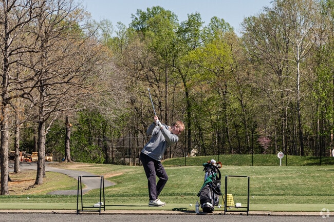 A Lake Monticello resident practices his swing at the driving range.