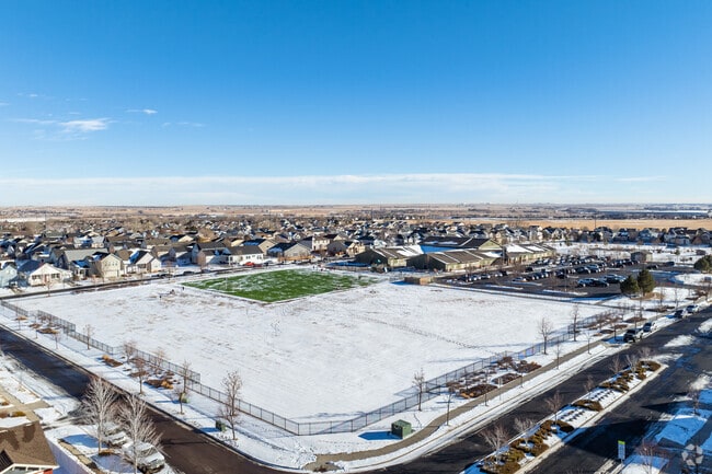 The expansive sports fields and outdoor play areas at Foundations Academy in Brighton, Colorado.