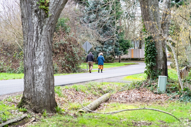 Locals enjoy a walk down the streets of the Churchill Neighborhood.