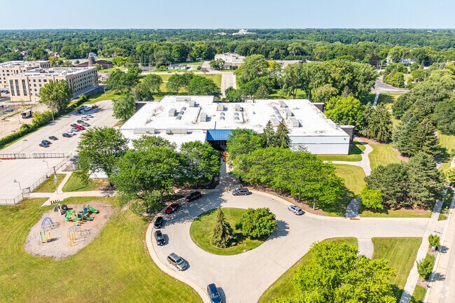 The campus of the Gilmore Fine Arts School is surrounded by trees in the Wustum Park area.