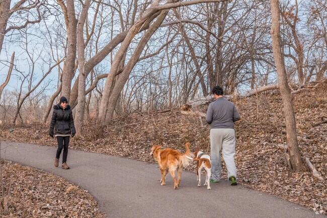 People walking on the trail at the Bass Lake Preserve.