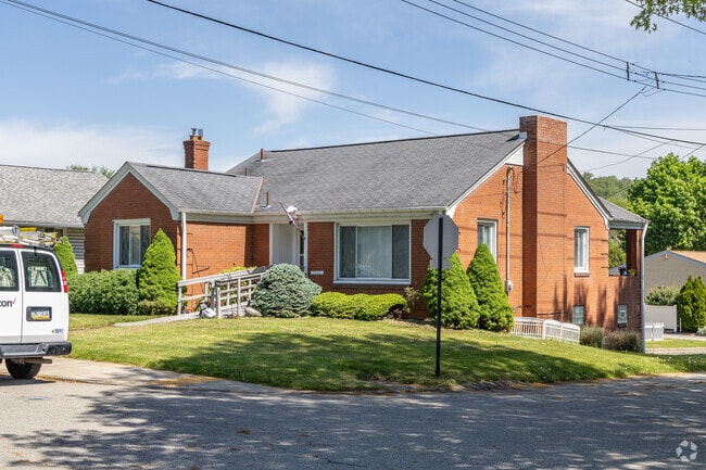 Minimal traditional homes line the streets of White Oak.