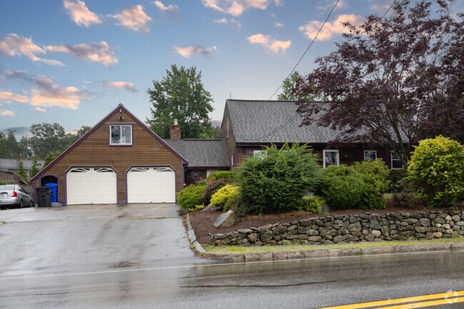 This Cape Cod with cedar and redwood exterior is nestled in Wellington Manchester