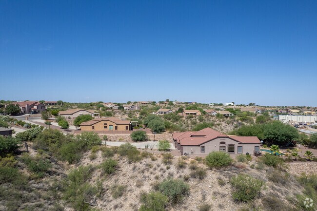 Many Vail homes are nestled among desert hills.
