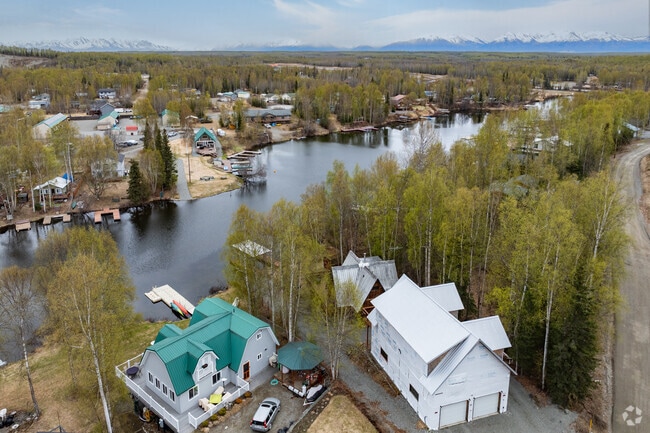 Custom homes in Big Lake are common on wooded lots with lake access.