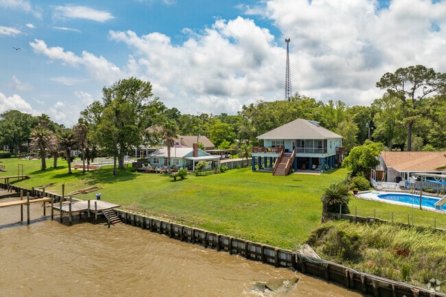 Raised beach houses line the bay front in Heron Bay, AL.