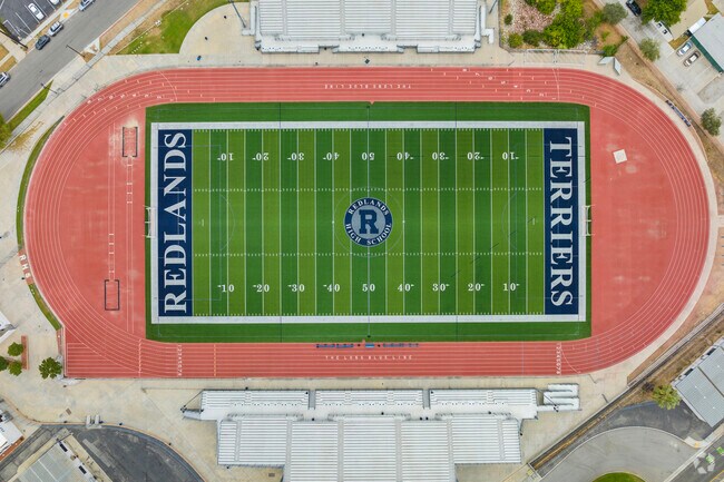 Celebrating sportsmanship and skill on the football field of Redlands High School.