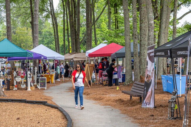 Local vendors line the sidewalks that run through Grayson Park for the annual Grayson Day.