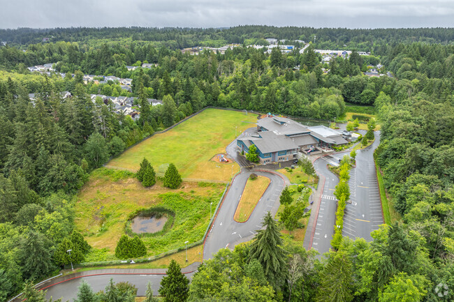 Aerial views of Pinecrest Elementary school, parking and field.
