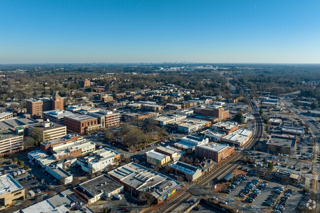 Aerial over Downtown Marietta looking towards Atlanta skyline