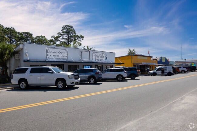 A sunny day highlights Lanark Village’s small but vibrant commercial strip on U.S. 98.
