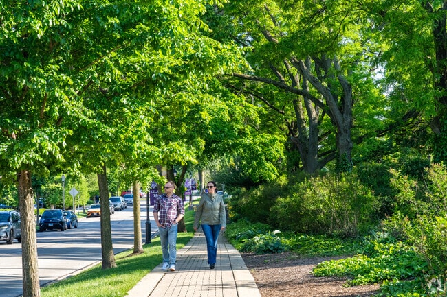 Flowerfield has beautiful walkways surrounded by foliage in the summer.