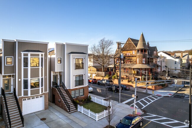 New single family homes next to a Victorian style in Harrison.