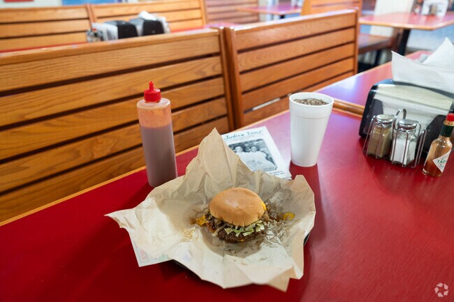 Judice Inn in Mimosa Place has been serving burgers alongside their secret sauce since 1947.
