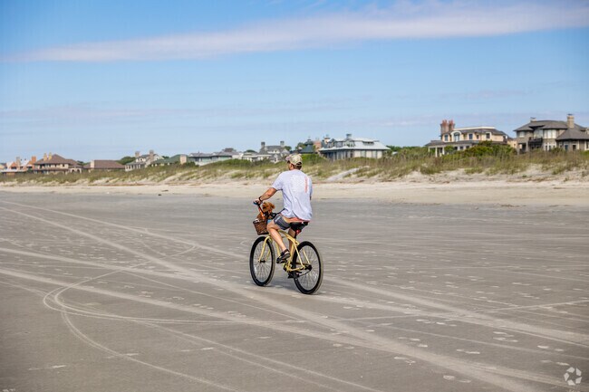 Take your bike for a ride on the beautiful beaches on Kiawah Island.