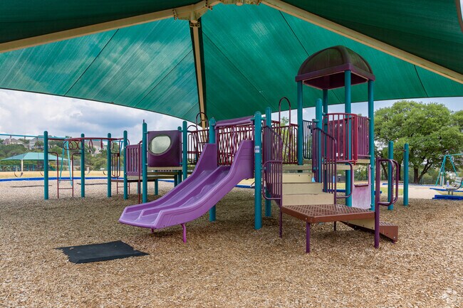 Enjoy the shaded playground at Steiner Ranch Elementary.
