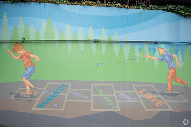 Colorful mural of kids at play in the Clyde Hill neighborhood.