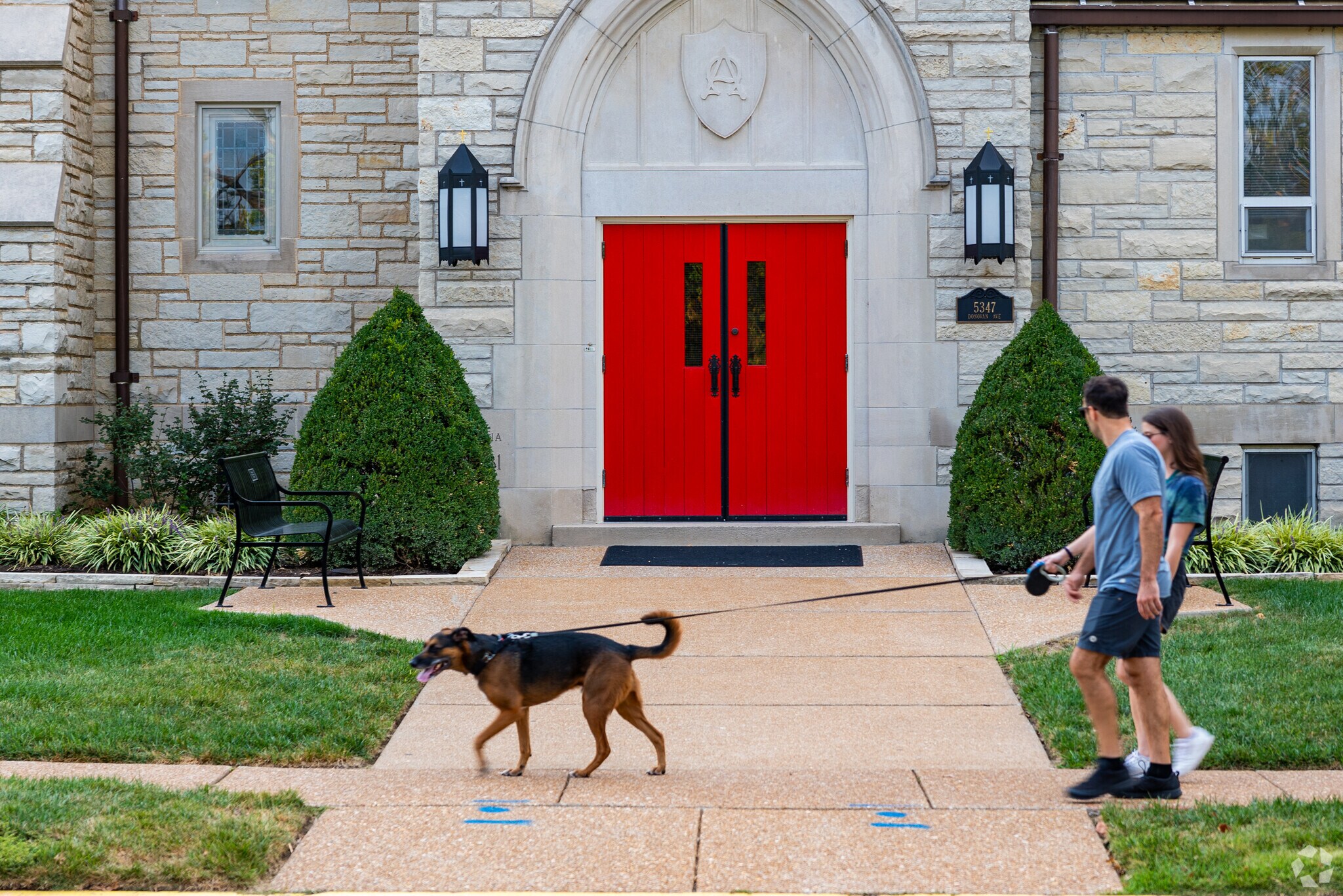 Residents enjoy an evening walk with their 4 legged friends in St Louis Hills.
