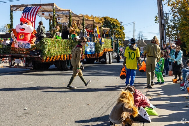 Kids snatch up tossed treats at the Woburn Halloween Parade.