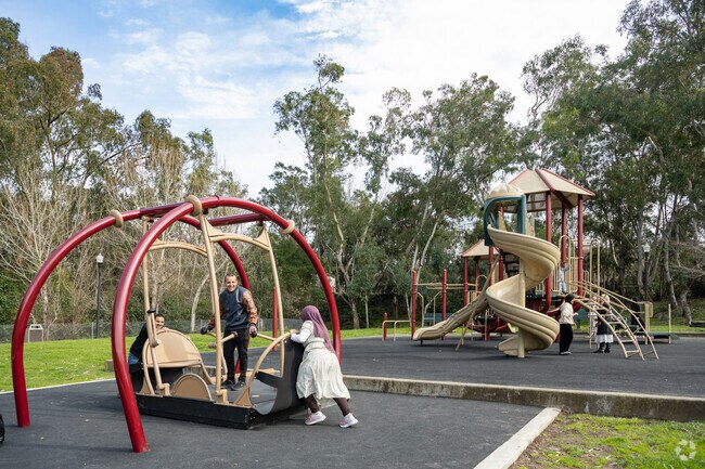 Families enjoy playing at Refugio Valley Park in Village Park.